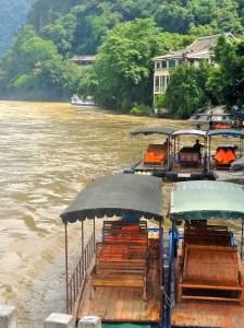 Motorized tourist boats along the Li River in Yangshuo, China