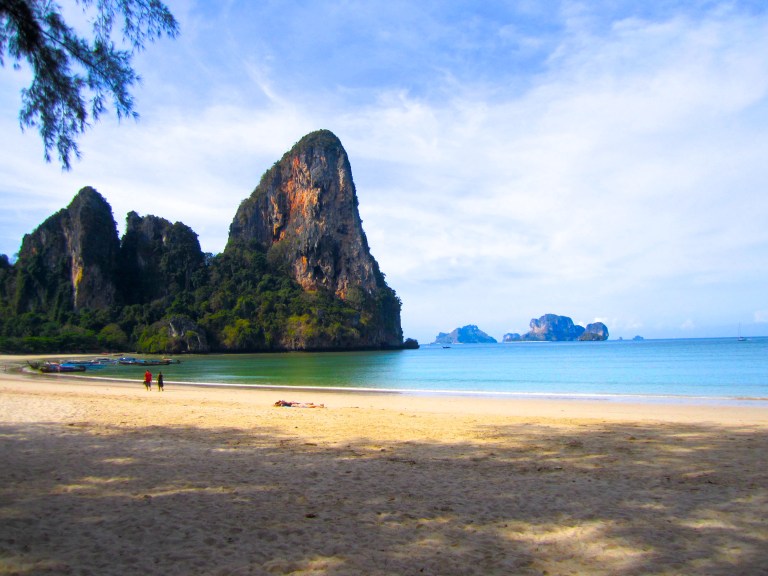 Massive limestone cliffs on the west side of Railay beach
