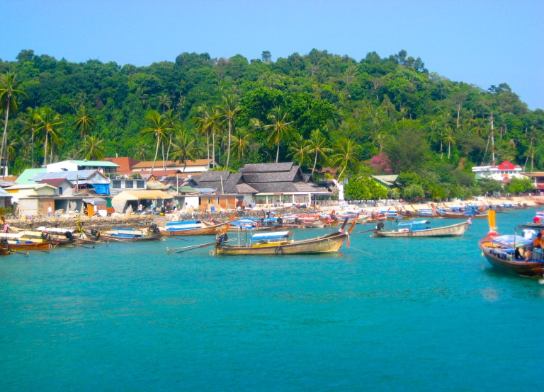 Scene of the long-tail boats on the beachfront near Long Beach in Krabi, Thailand