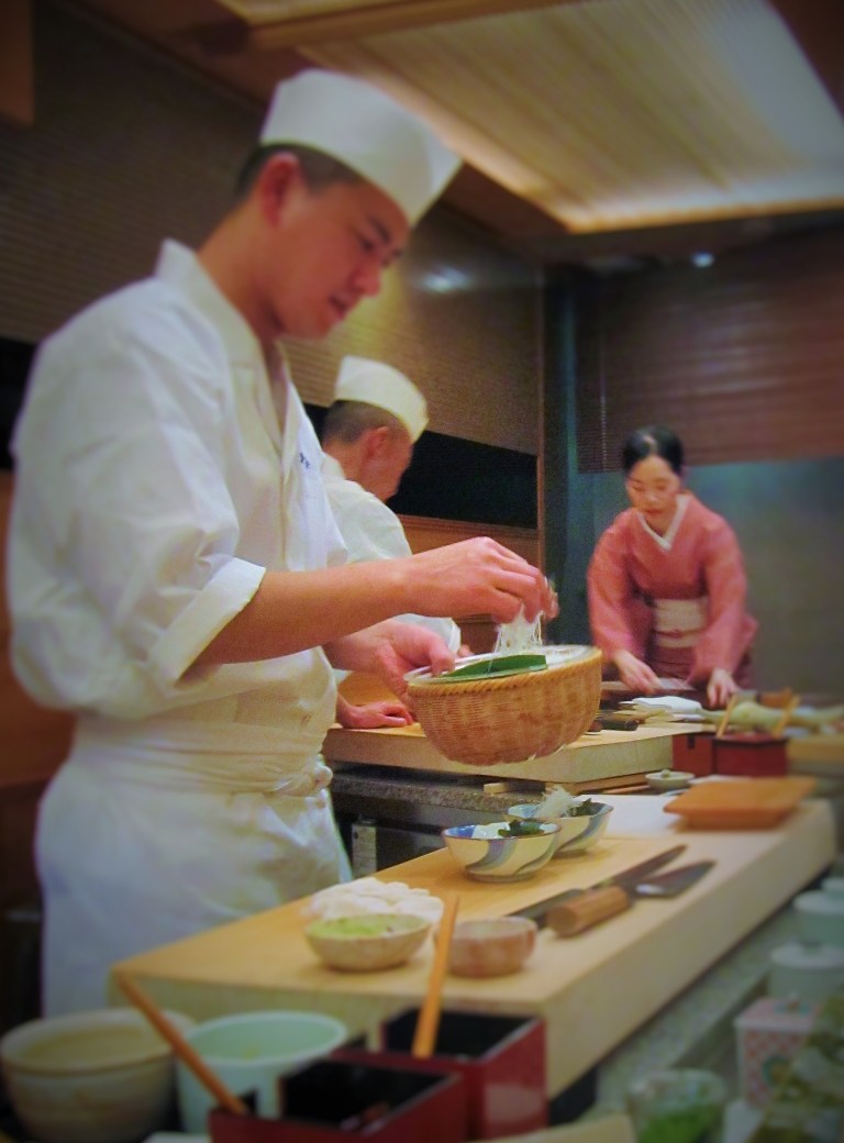 Kyubei's sushi chef preparing nigiri sushi for the diners 