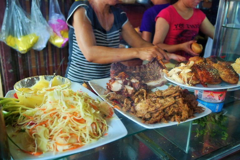 Woman making banh mi at Banh Mi Phuong in Hoi An