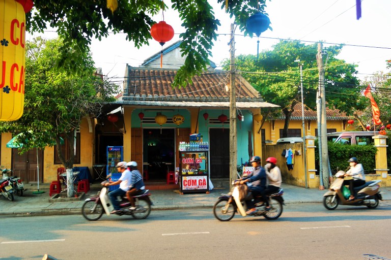 Locals motorbiking in Hoi An's Old Town