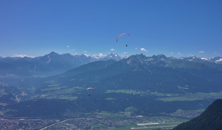Parasailers over the Alps in Innsbruck, Austria